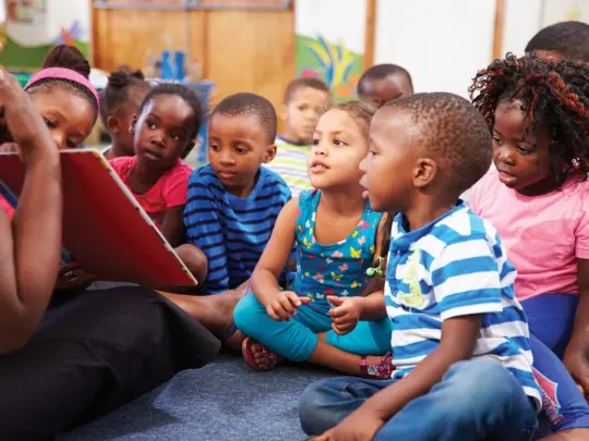 iStock-484794658-TEACHER-READING-TO-PRESCHOOLERS