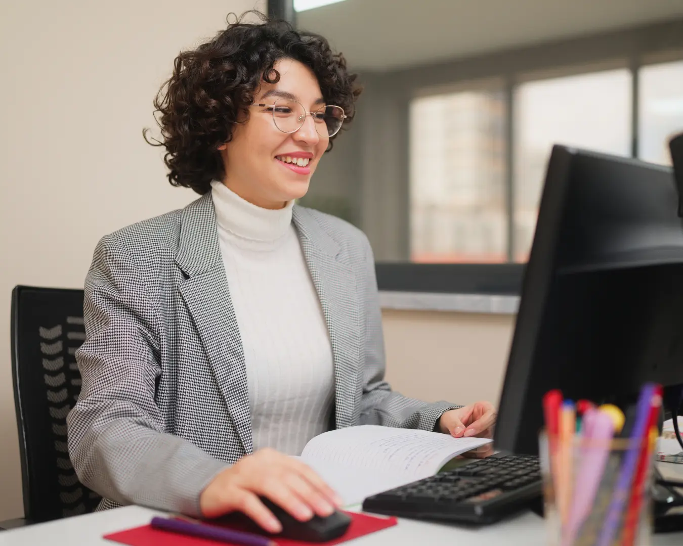 Female teacher working on computer