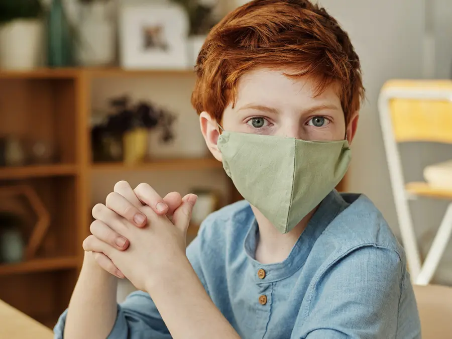 boy-in-blue-long-sleeve-shirt-wearing-face-mask-4145249.jpg