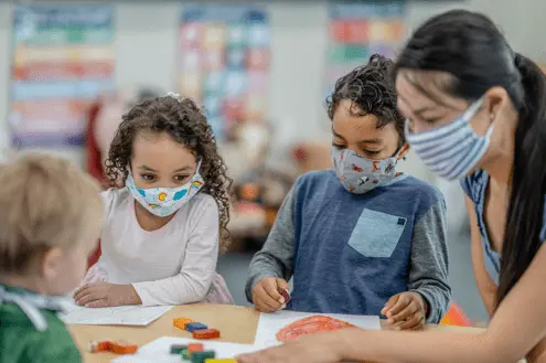 kids-and-teacher-wearing-masks.png
